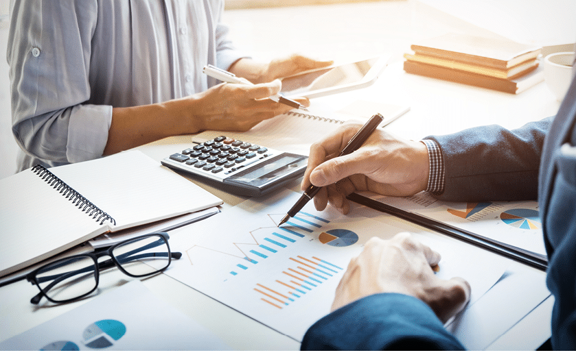 business man financial inspector and secretary making report, calculating or checking balance. Internal Revenue Service inspector checking document. Audit concept